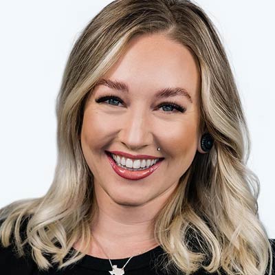 Woman smiling after receiving a Lash Lounge Service