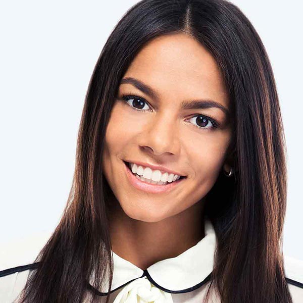 Woman smiling after receiving a Lash Lounge Service