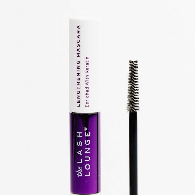 Closeup of The Lash Lounge's lengthening mascara tube and applicator wand