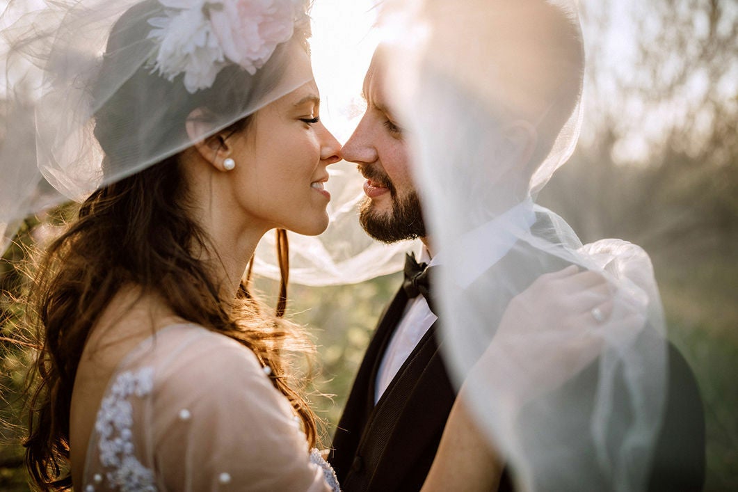 A bride and groom looking at each other during their outdoor wedding