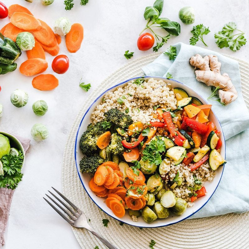 A bowl of healthy grains, carrots, peppers, and other vegetables that support nutrition and inner strength