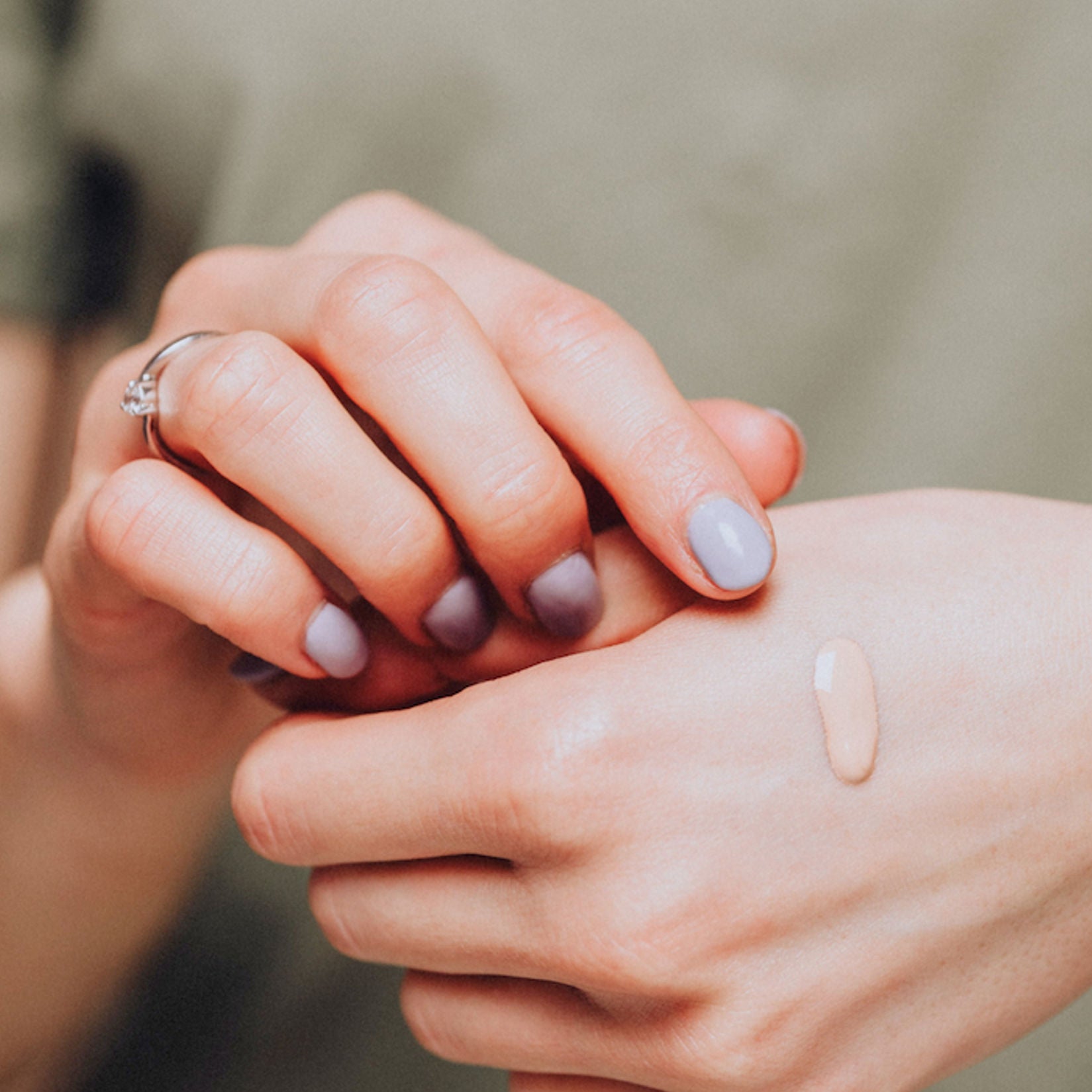 close-up of hand with tinted moisturizer sample