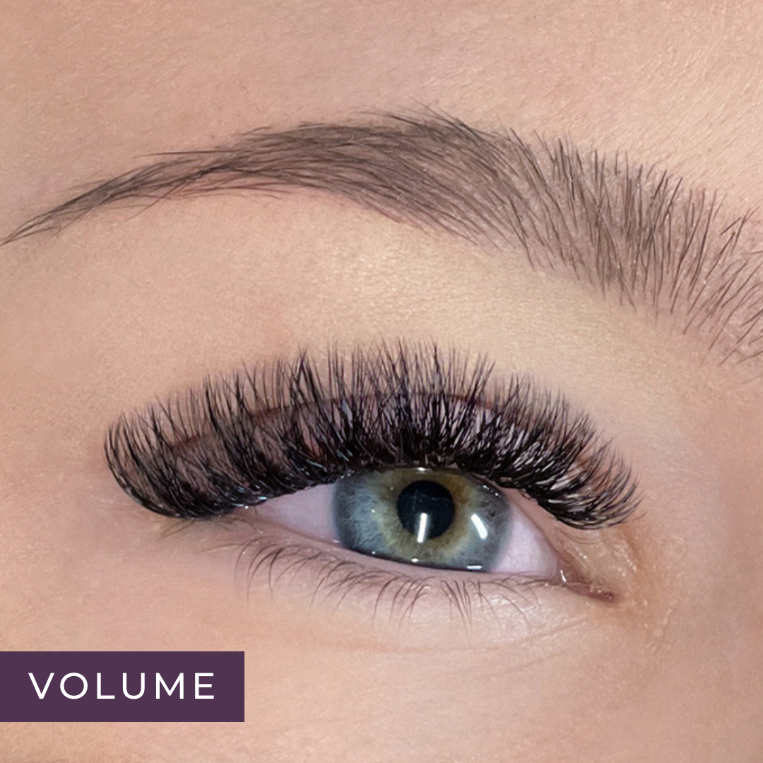 close-up of woman's blue eye with a full set of volume lash extensions