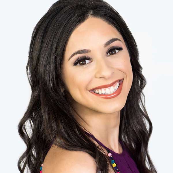 Woman smiling after receiving a Lash Lounge Service