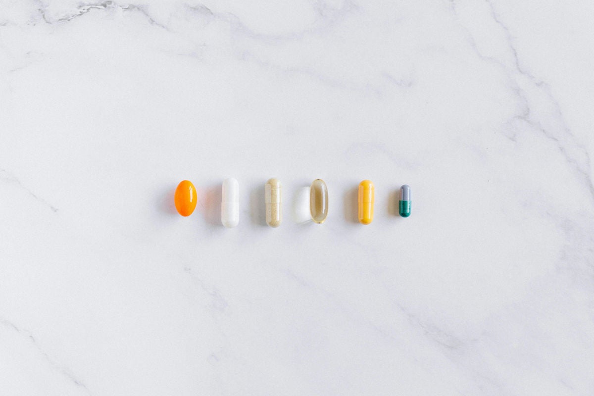 vitamins and supplements on marble