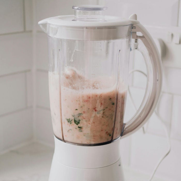 white blender with smoothie