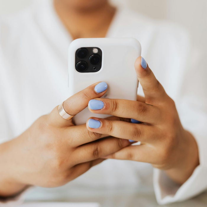 close-up woman's hands holding phone